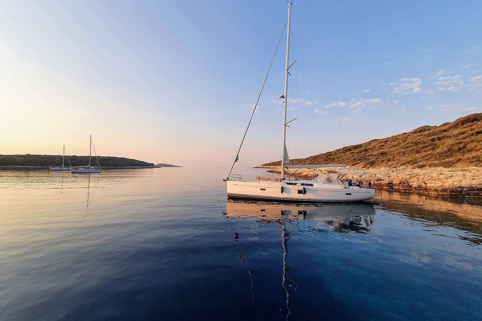 Sailing boat at anchor in a bay of the Pakleni Islands, Croatia