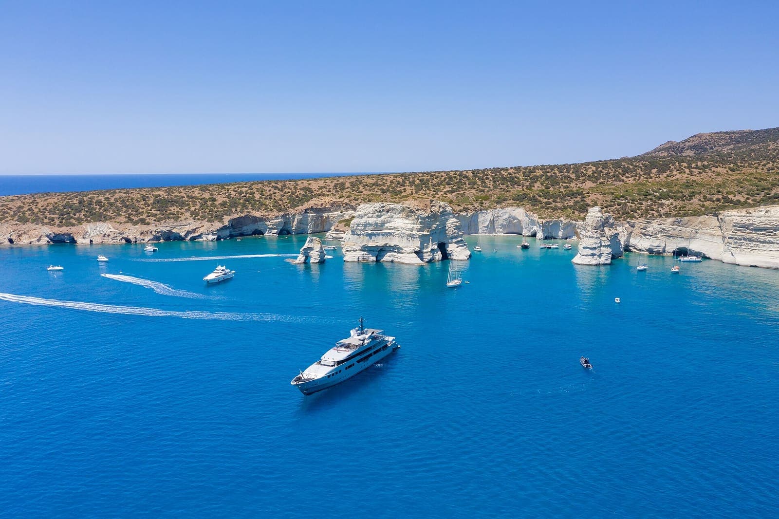 Aerial view of a motor yacht anchored at Kleftiko, Milos