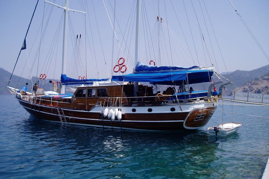 Poyraz — Wooden gulet on a Blue Cruise moored in clear turquoise water
