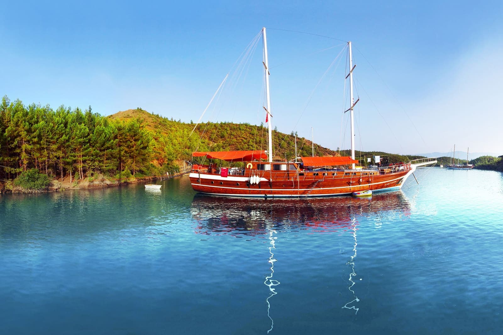 Yakamoz — Gulet reflected in the still water of English Harbour, Turkey