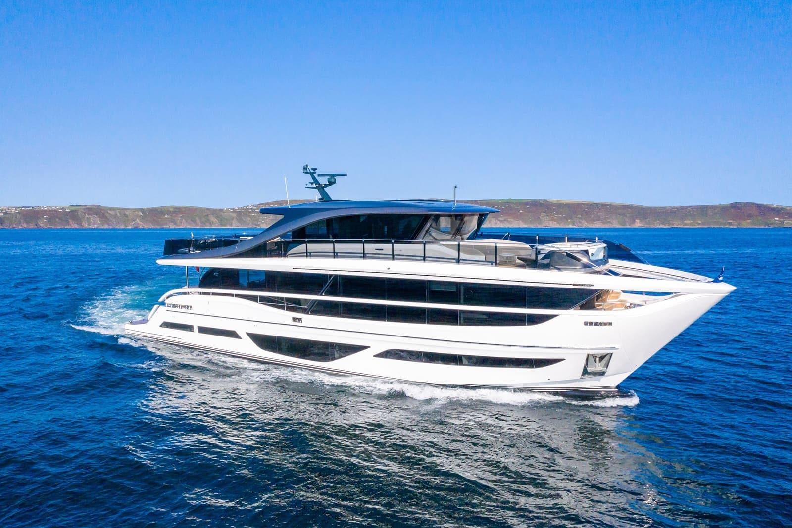 Kingfisher — Princess X95 motor yacht cruising at speed on blue water