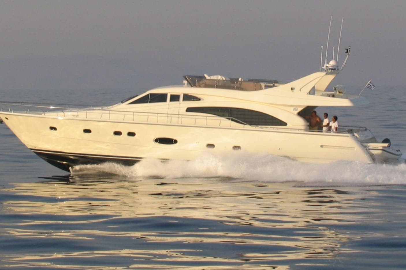 Côte Bleue — Ferretti 68 motor yacht cruising on a calm sea in warm evening light