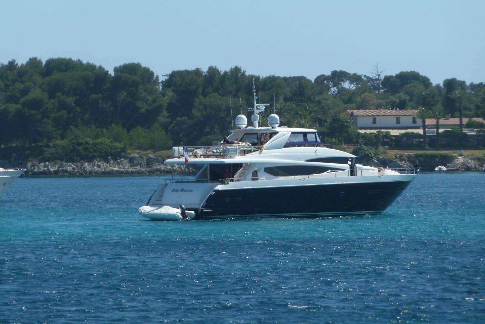 Duru — Princess motor yacht at anchor off a wooded coastline