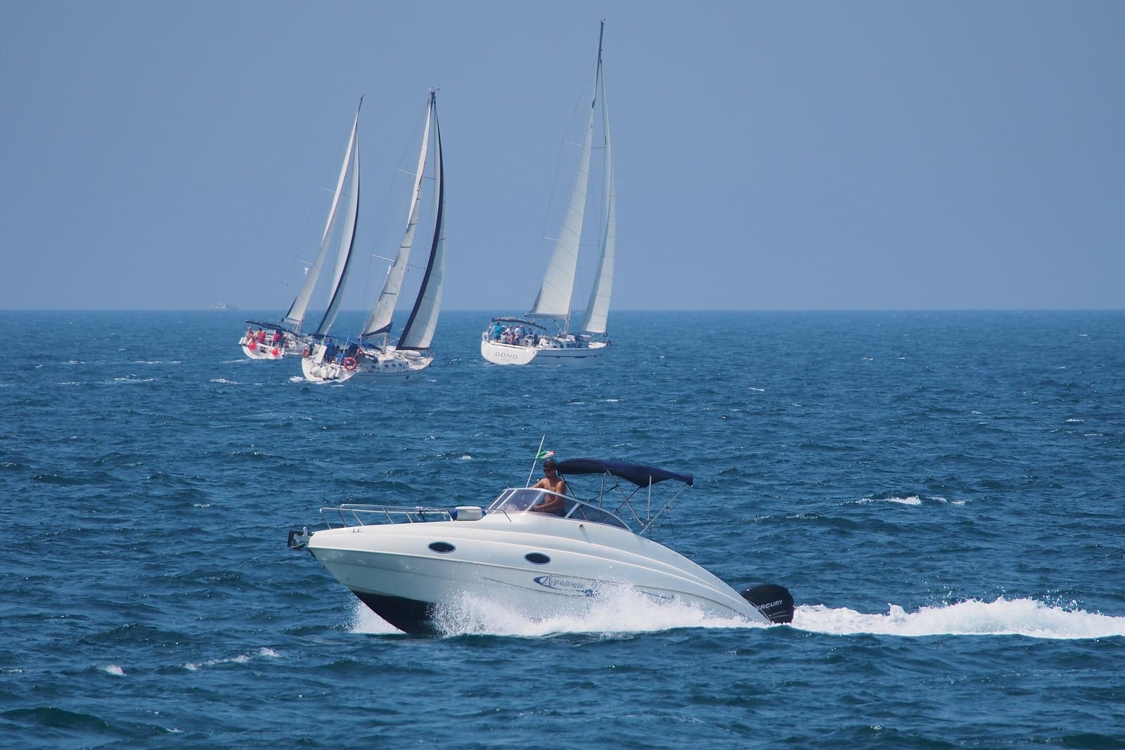 Ionia — Motorboat and sailing yacht on the Adriatic Sea