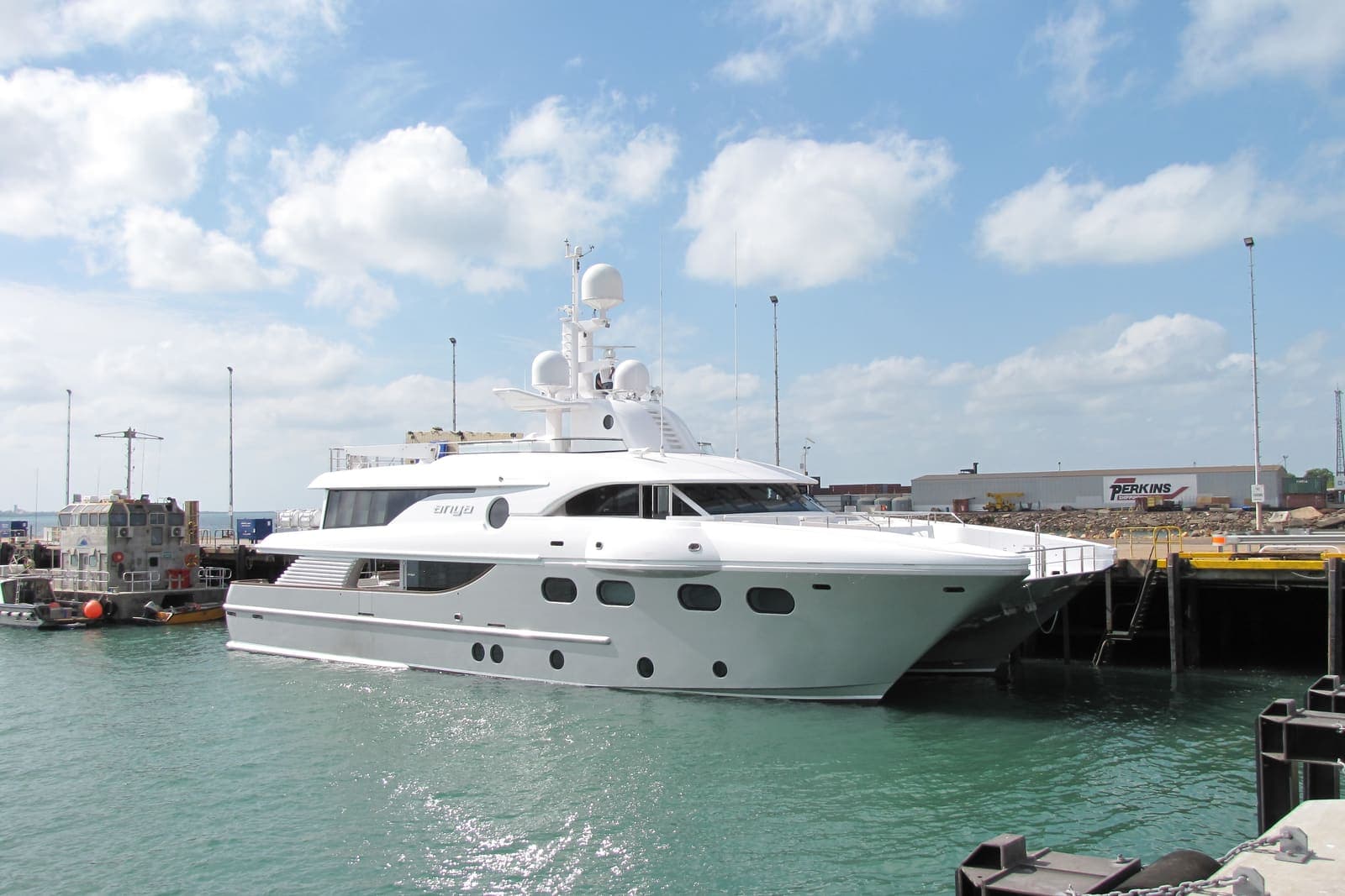 Golden Falcon — 35-metre luxury motor catamaran moored at a wharf in Darwin